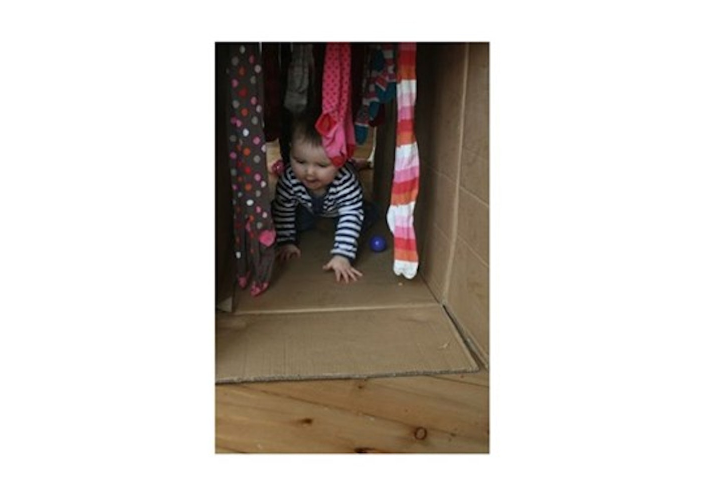 baby in cardboard box