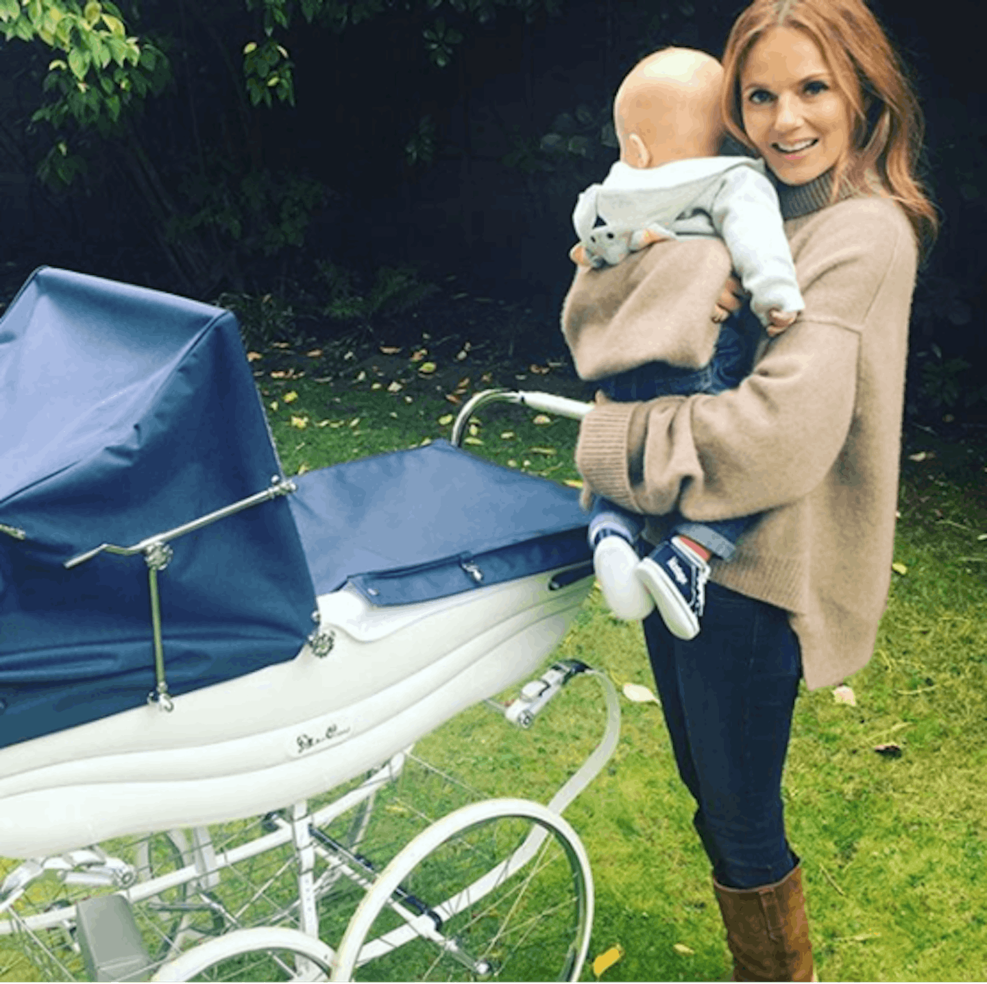 Geri Horner with baby and silver cross balmoral