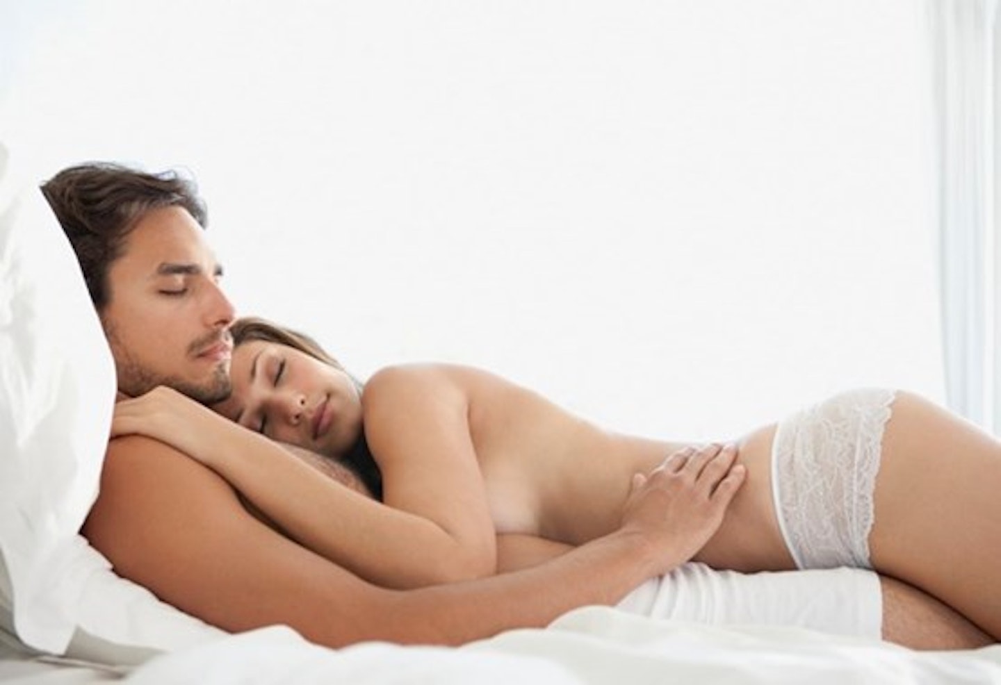 An image of a man and woman lying down