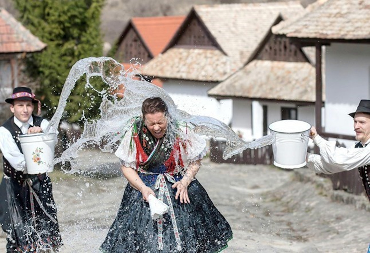 Woman being splashed with water