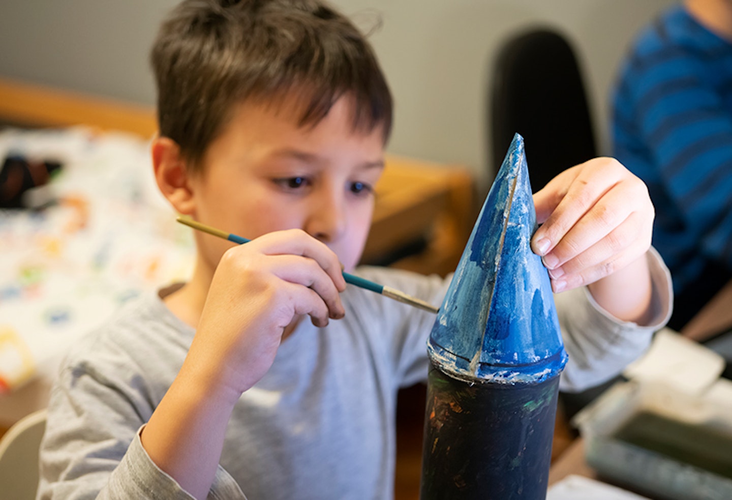child painting rocket