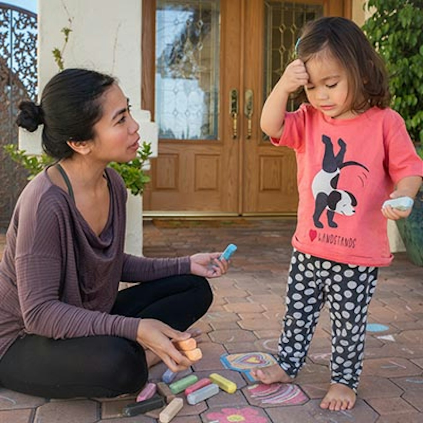 mum and toddler drawing with chalk