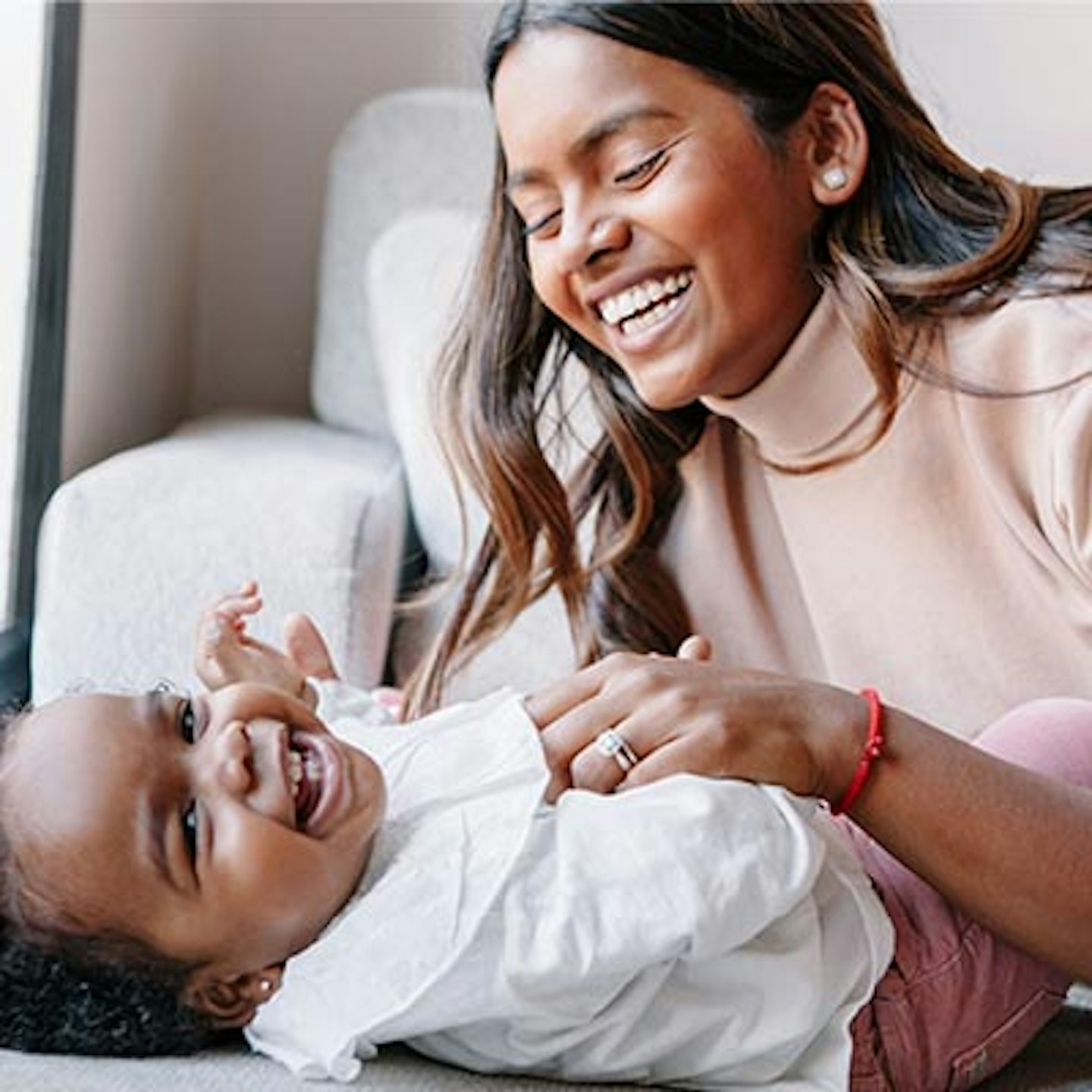 mum and baby laughing
