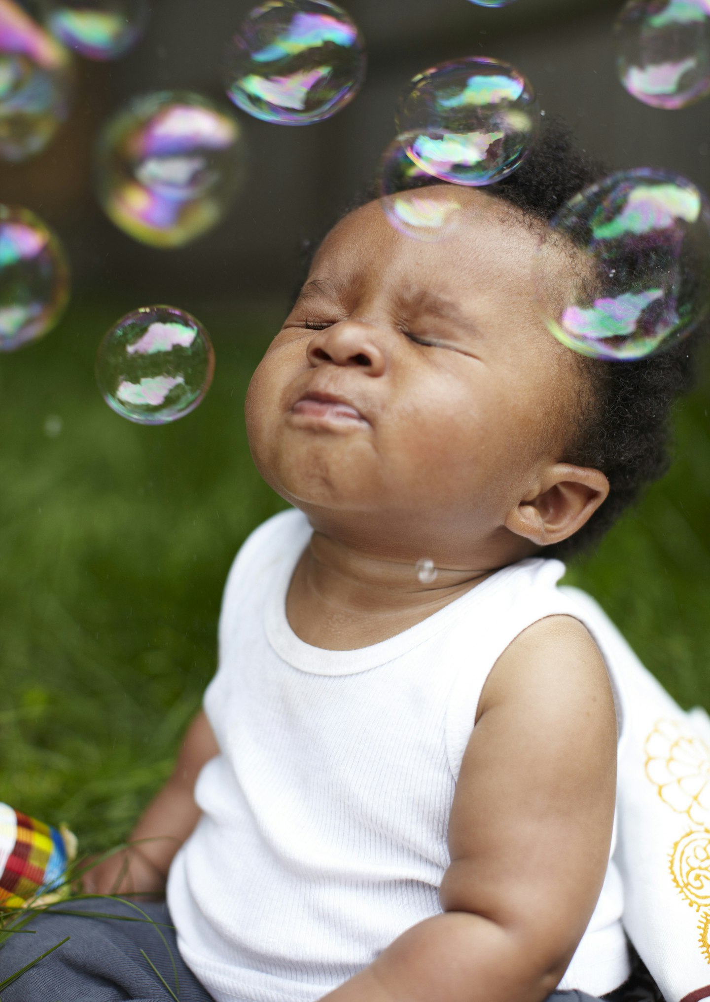 baby playing with bubbles