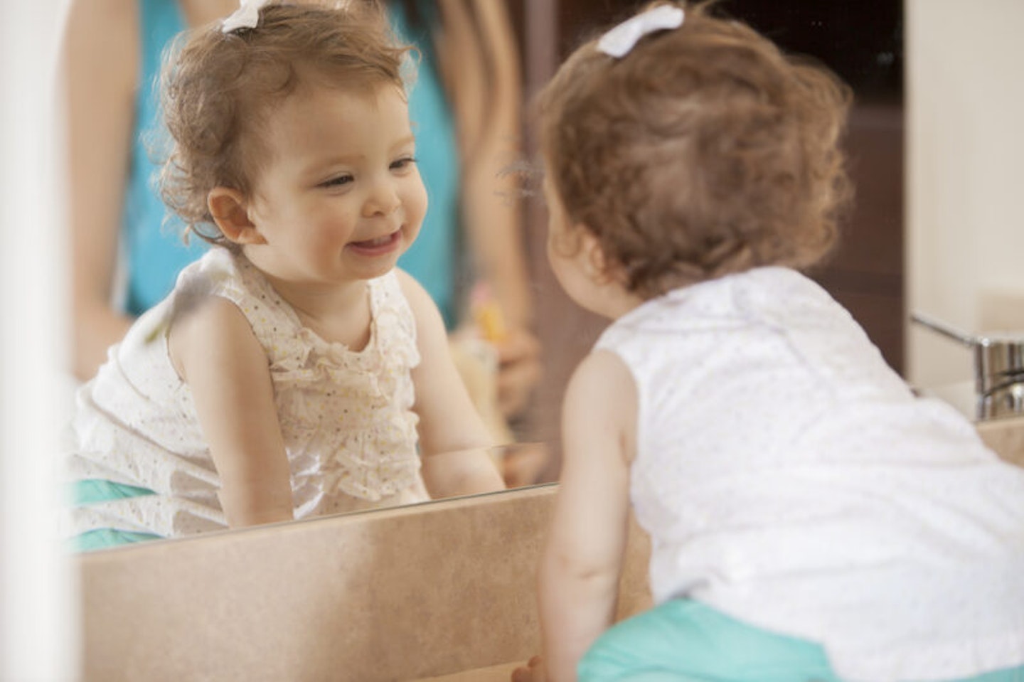 activities for babies baby looking in mirror