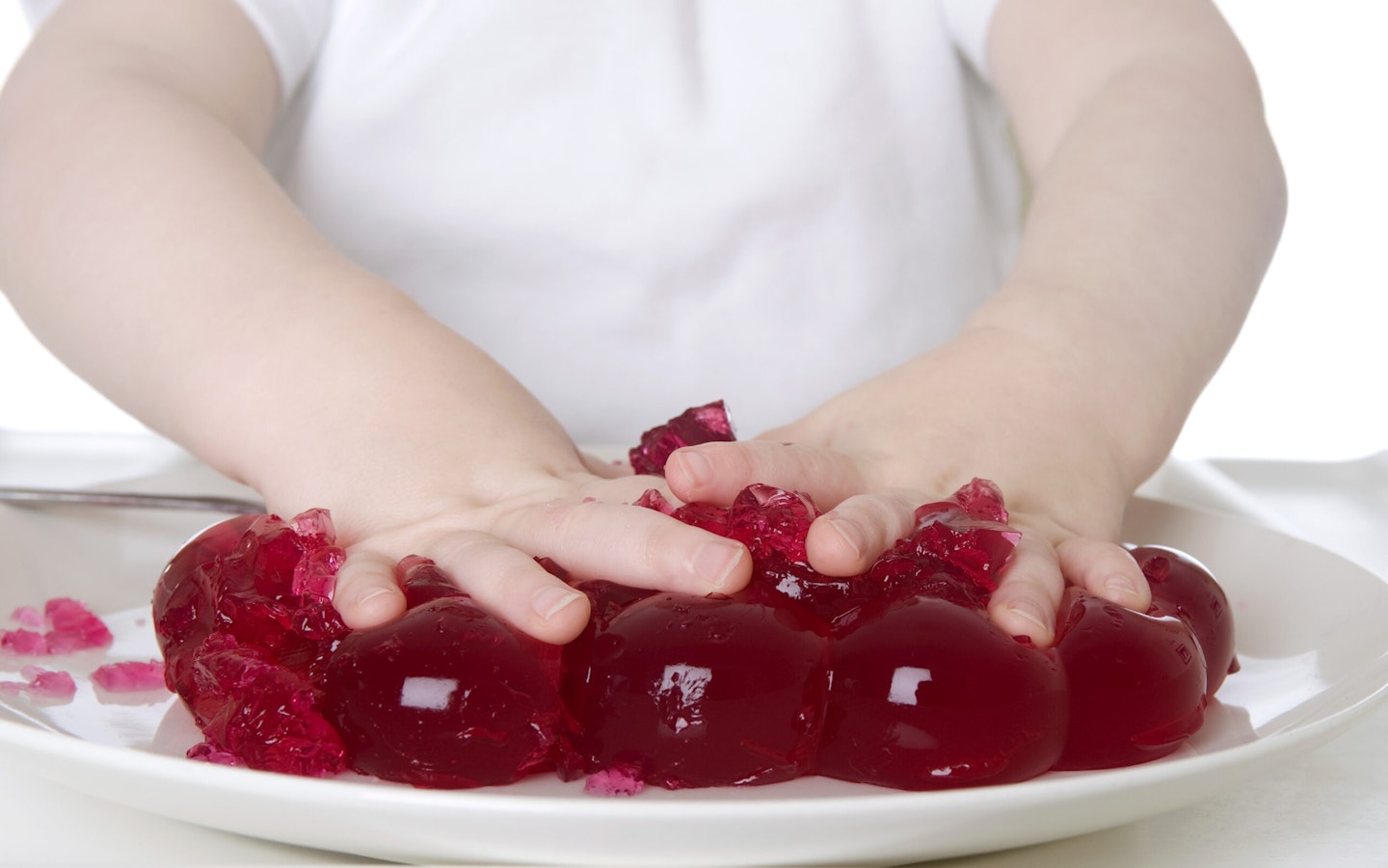 baby playing with jelly