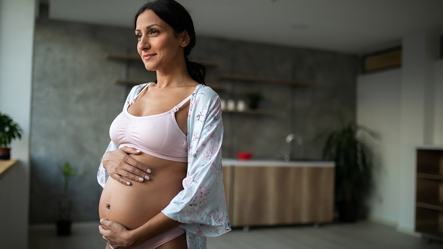 pregnant woman in maternity bra