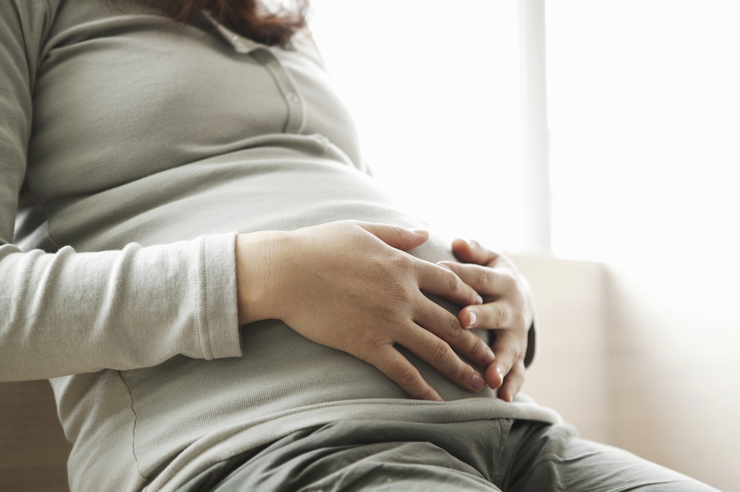 pregnant mum holding tummy