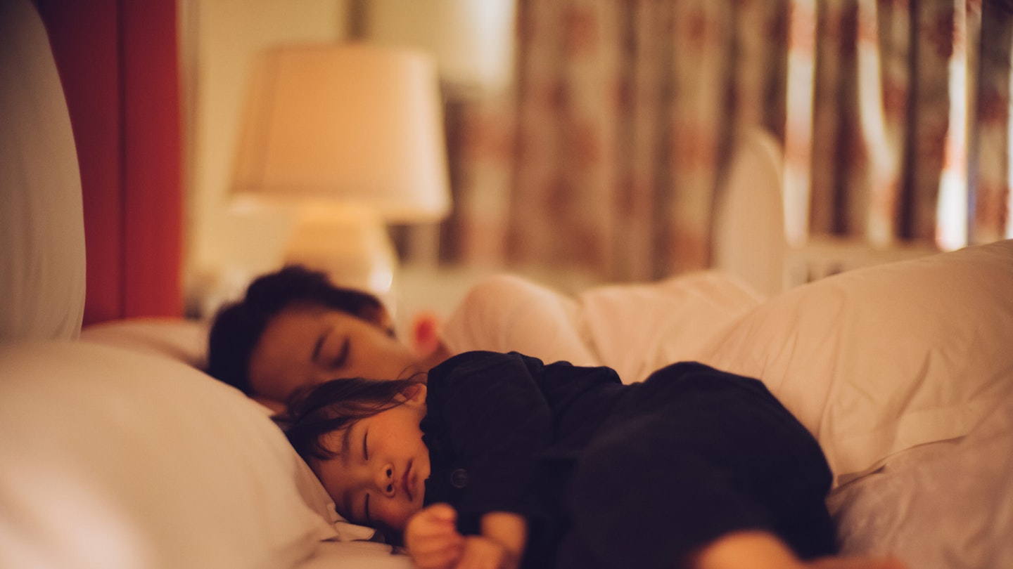 parent co-sleeping with a toddler
