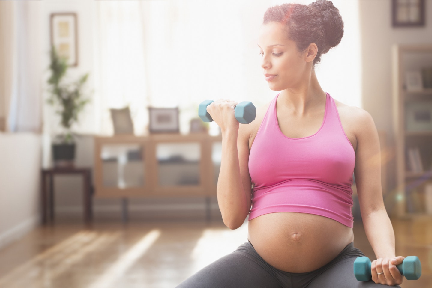 pregnant woman doing weight training