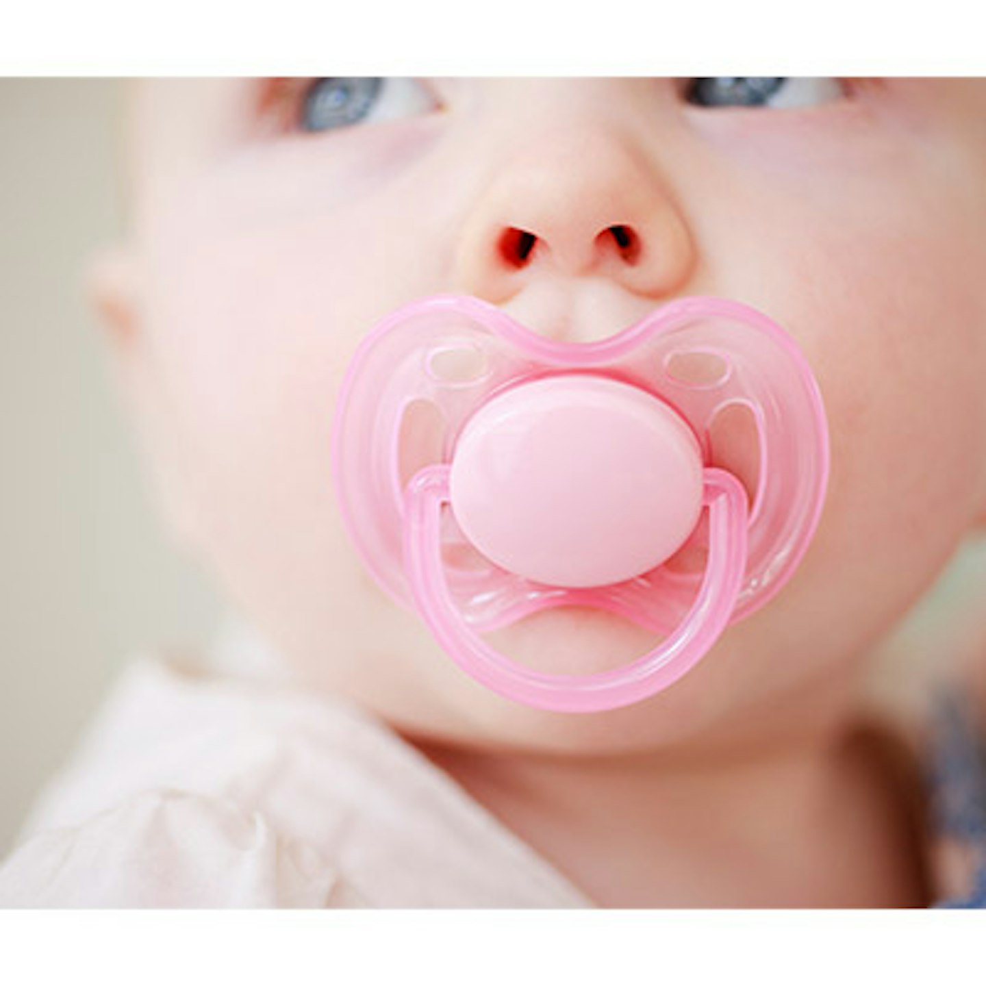baby with dummy in her mouth