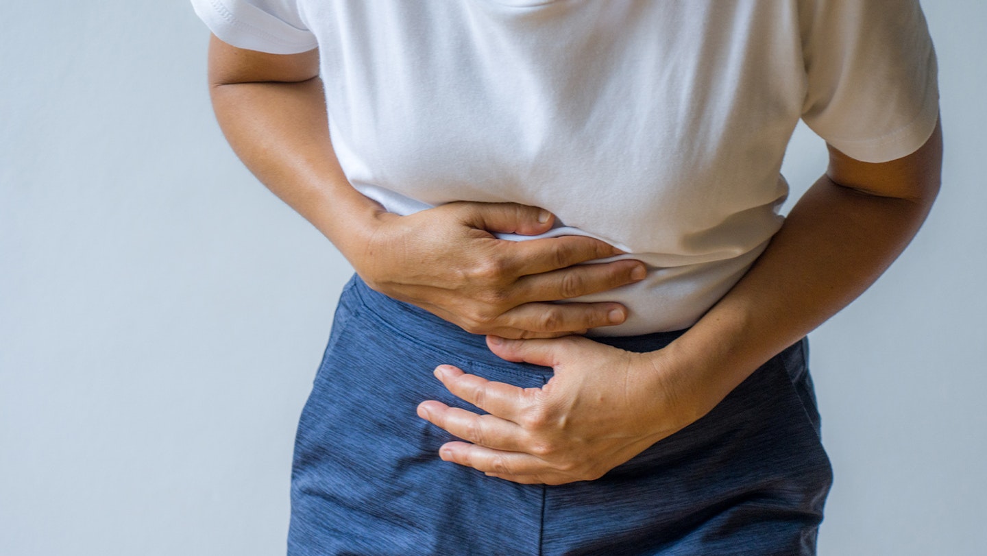 woman holding stomach