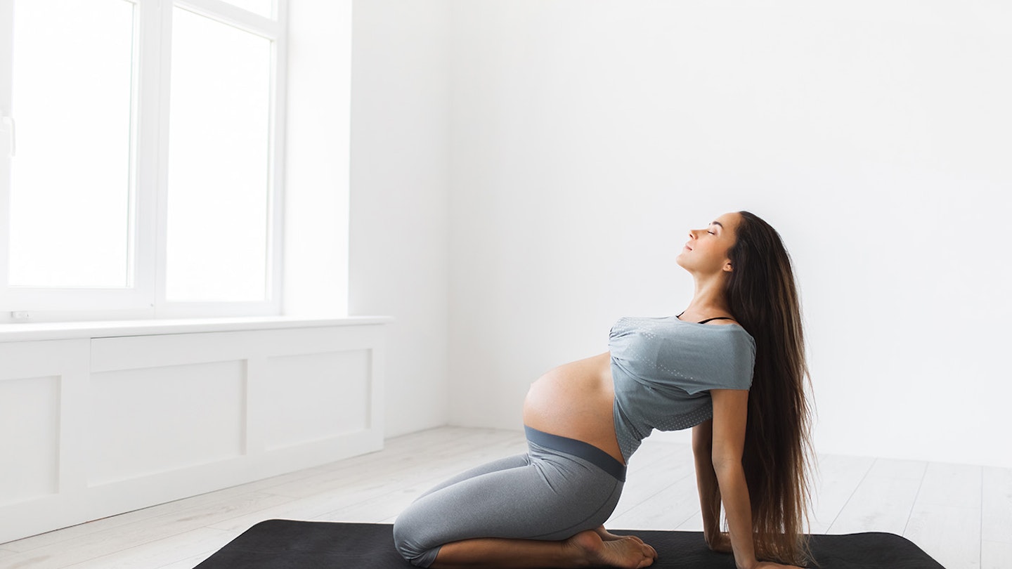 woman doing pregnancy yoga