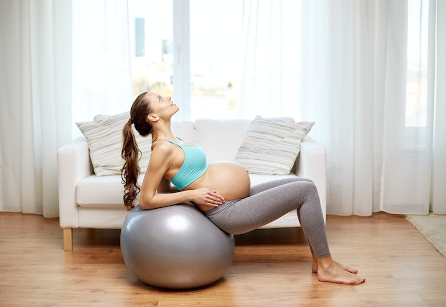 pregnant woman on birthing ball