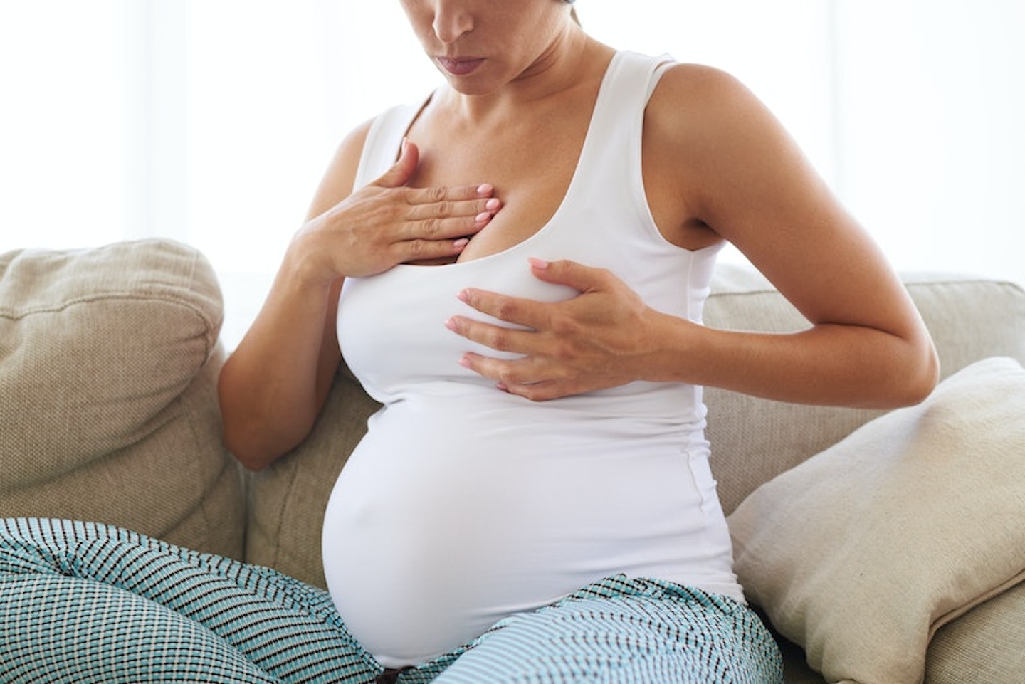 pregnant woman doing nipple stimulation