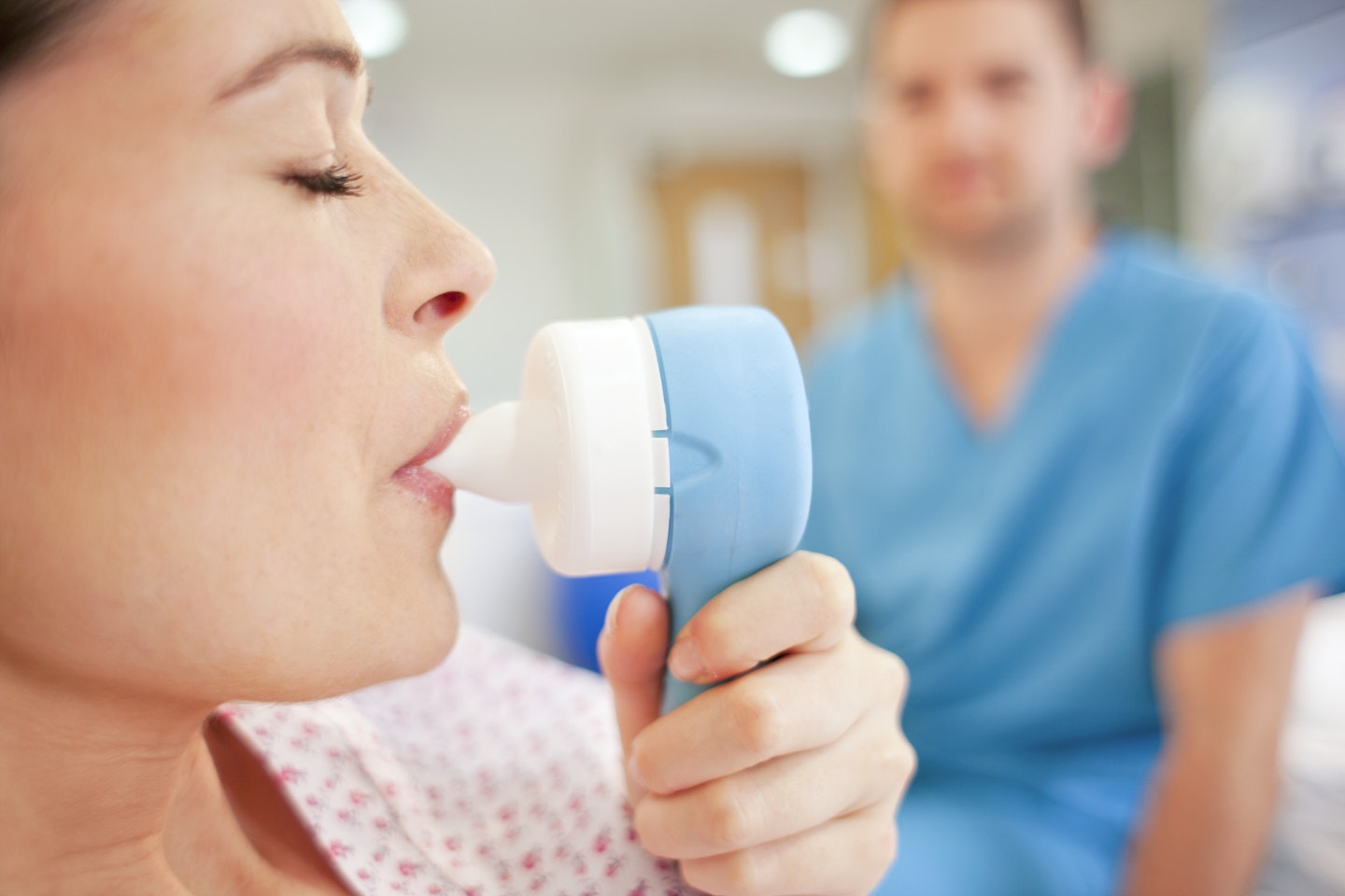 woman taking gas and air during labour