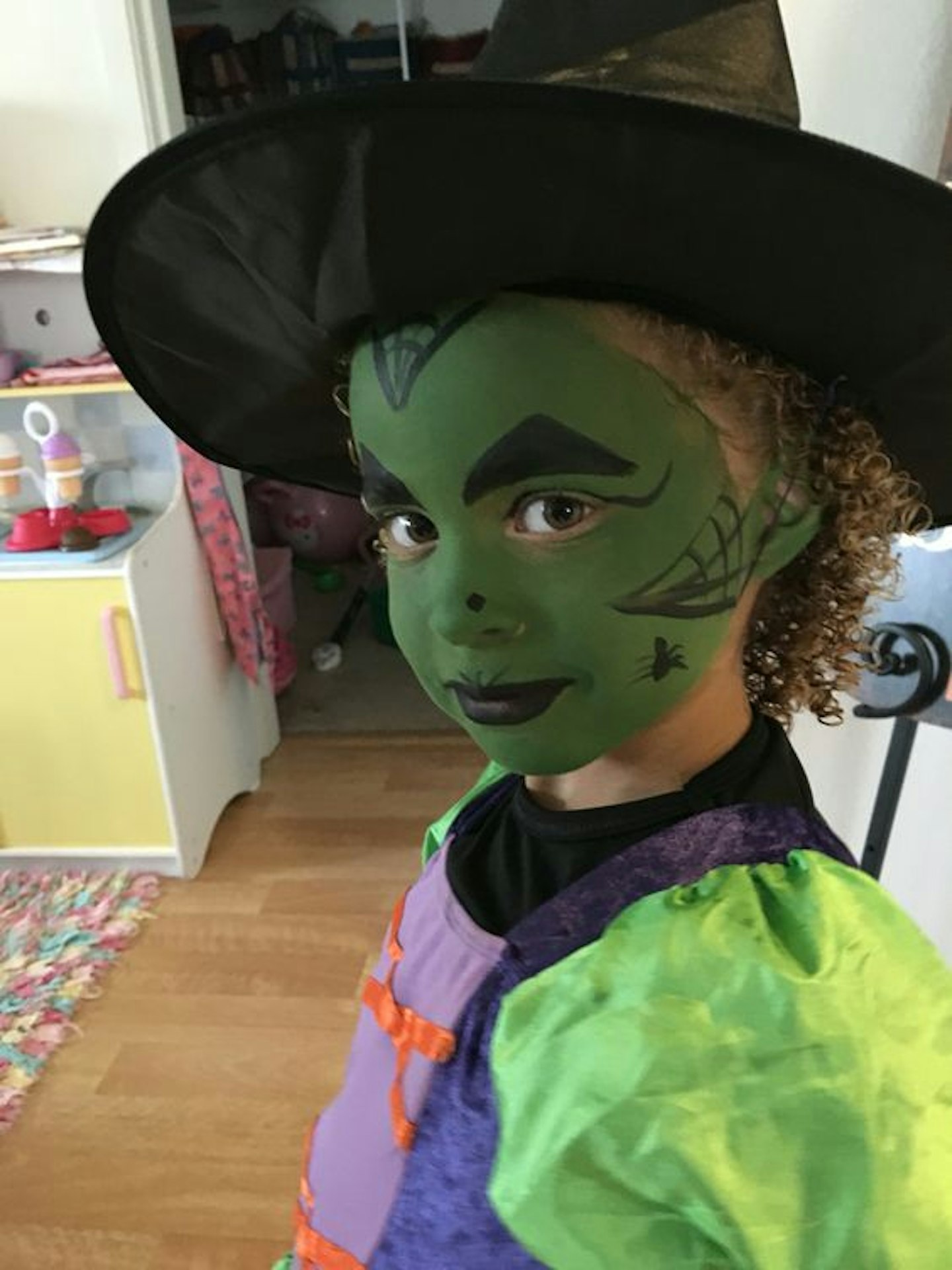 Green and black witch face paint