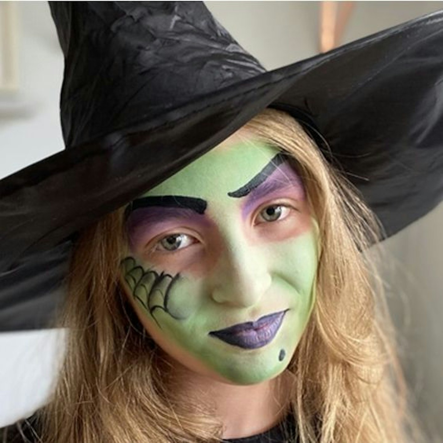 Witch face paint with mole