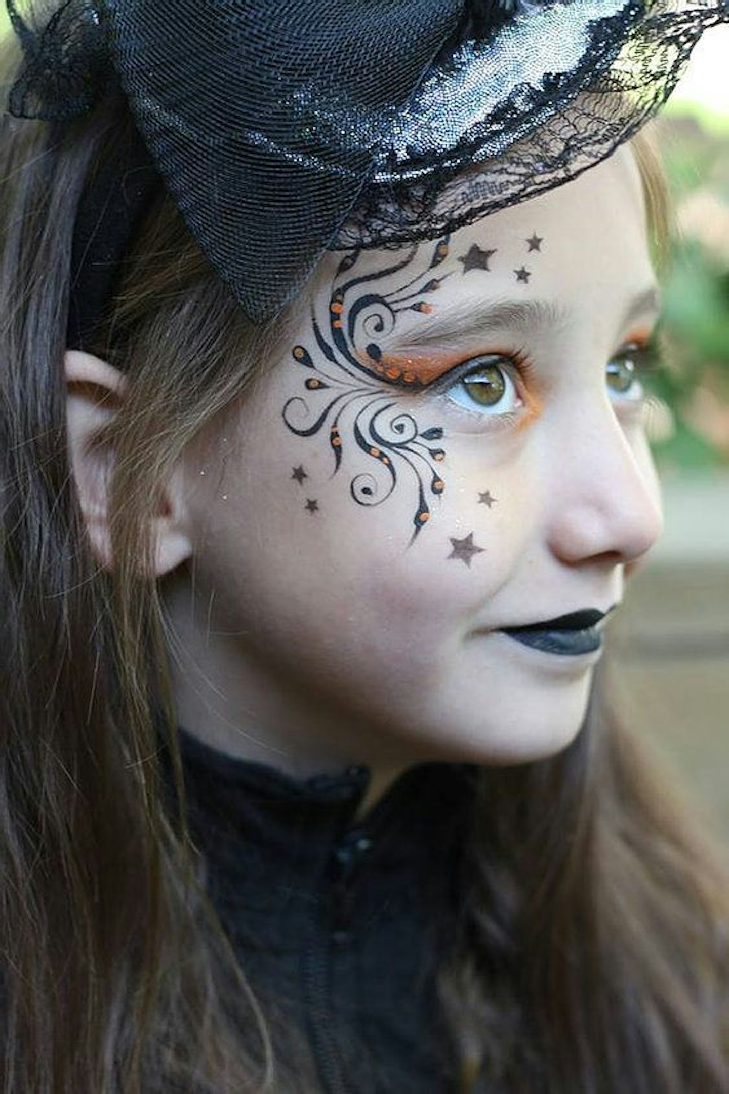 Stars and swirls witch face paint