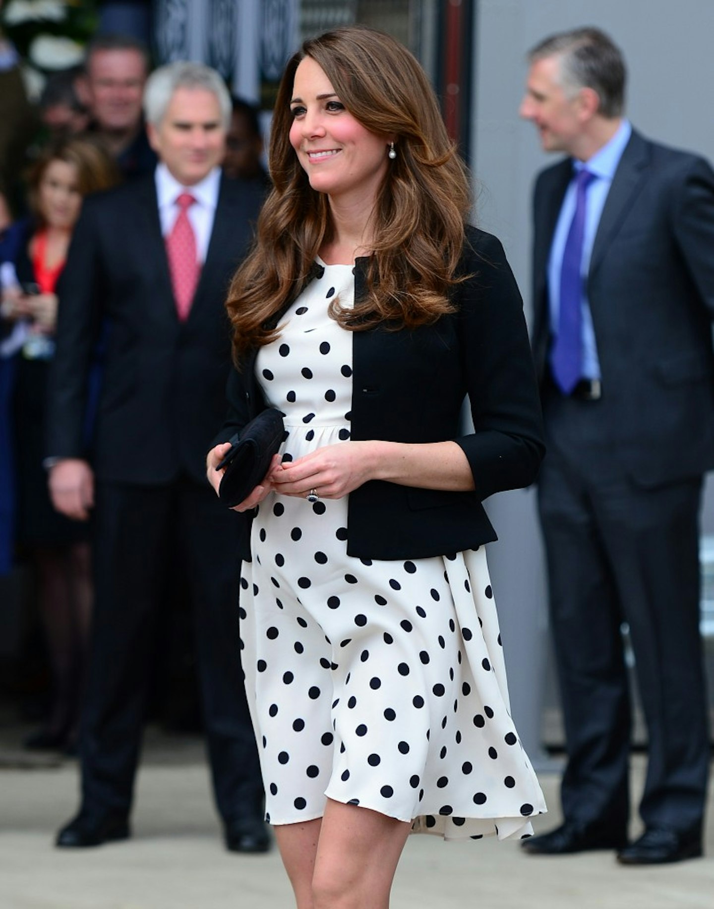 Kate turned to the high street for her maternity look in this snapshot. Pictured visiting the Harry Potter studios with Wills and Harry in London, Kate opted for a Topshop polka dot dress that suited the occasion perfectly. [Corbis]