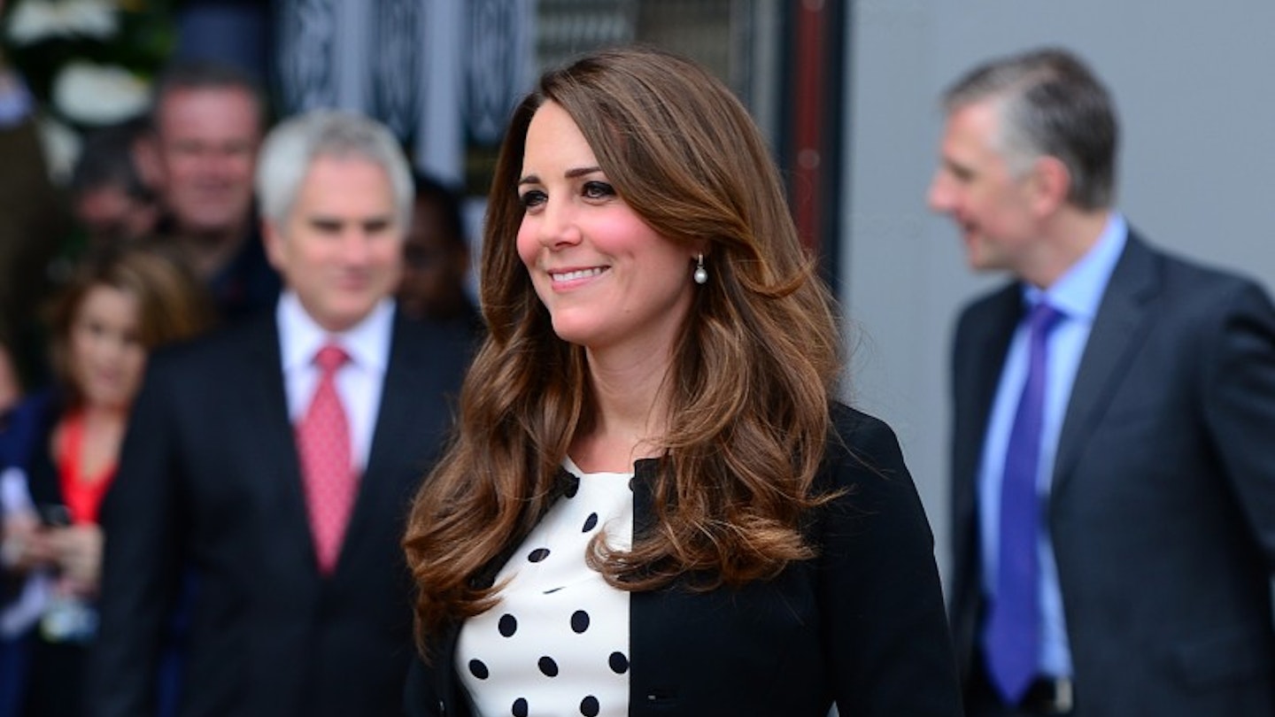 Kate turned to the high street for her maternity look in this snapshot. Pictured visiting the Harry Potter studios with Wills and Harry in London, Kate opted for a Topshop polka dot dress that suited the occasion perfectly. [Corbis]
