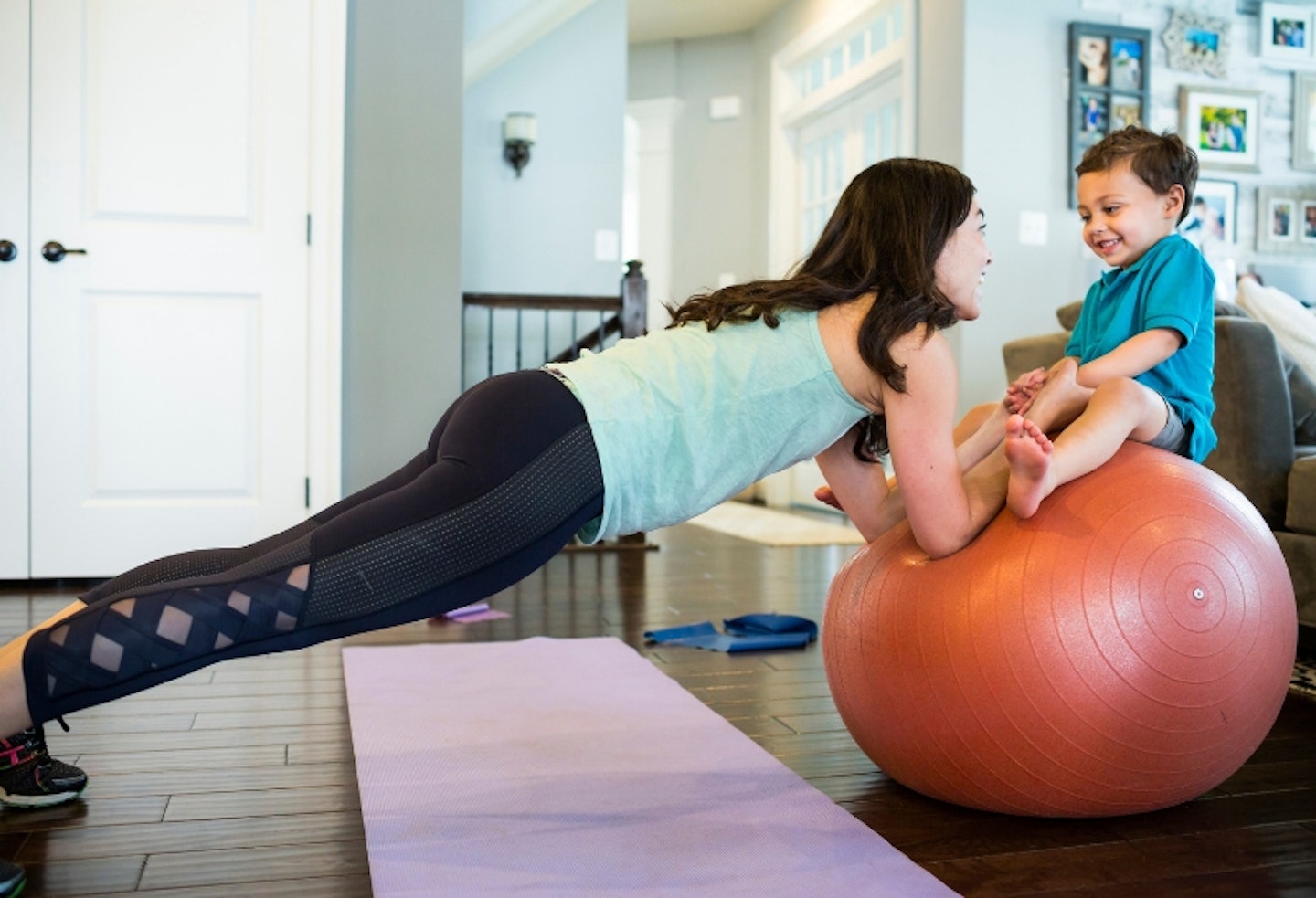 Baby exercising with mum