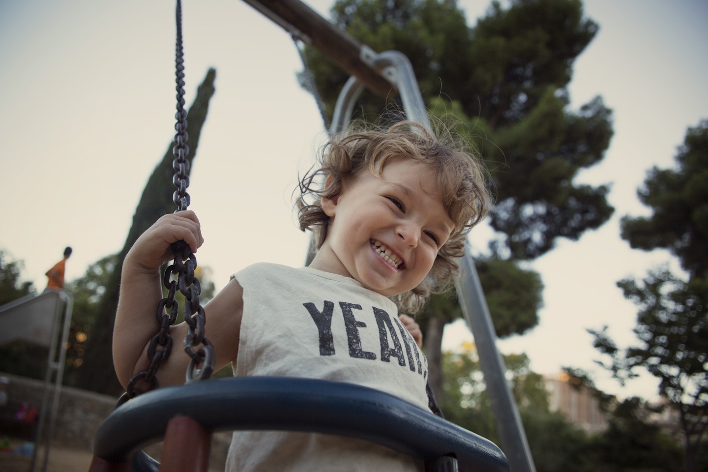 Child playing on a swing