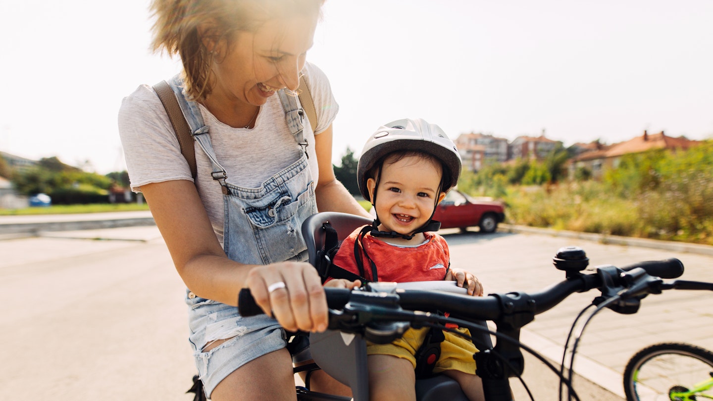 Parent and child on bicycle