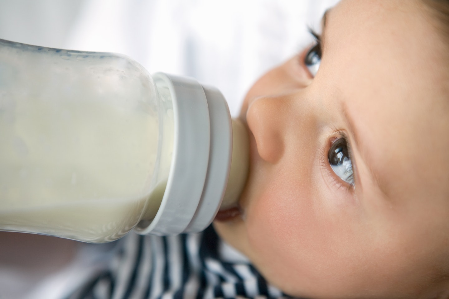 baby drinking milk from a bottle