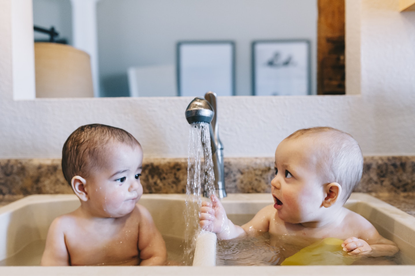 2 babies in the sink