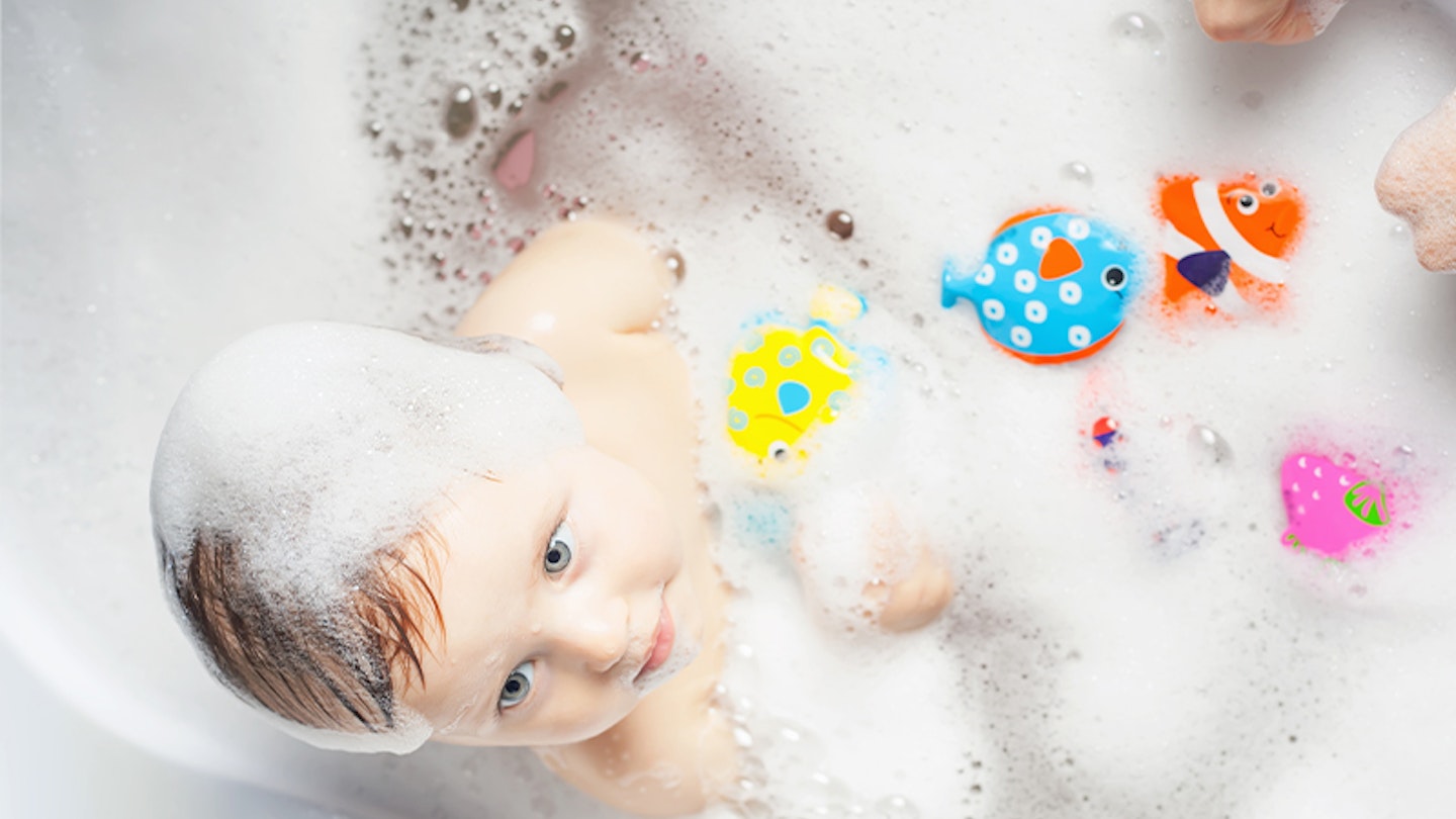baby with bath toys