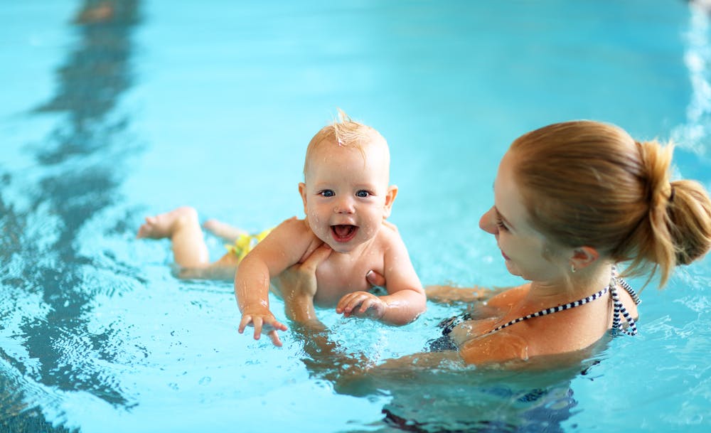 Baby and store parent swimming lessons