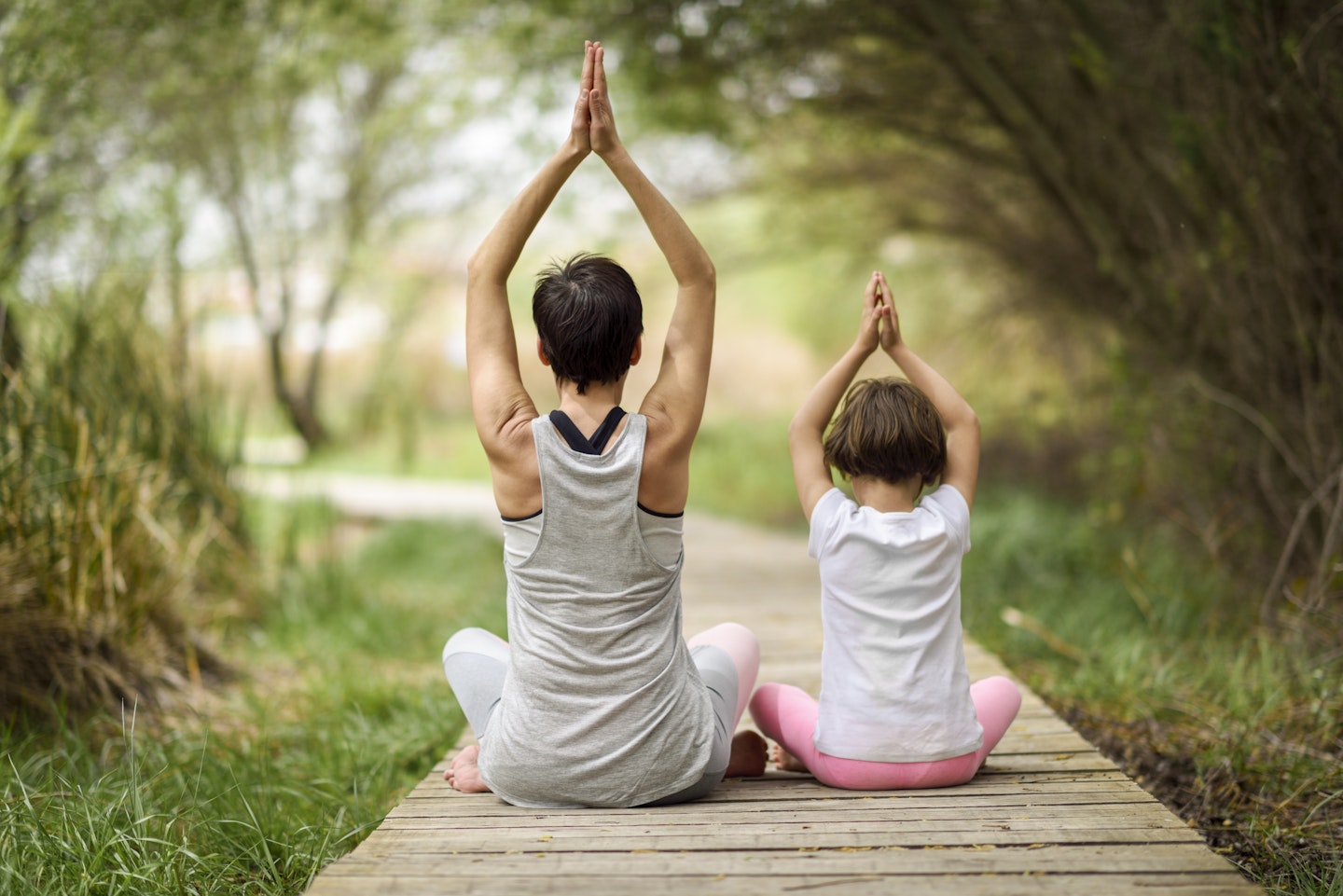 Parent and child enjoying some peace as they practice mindfulness together.