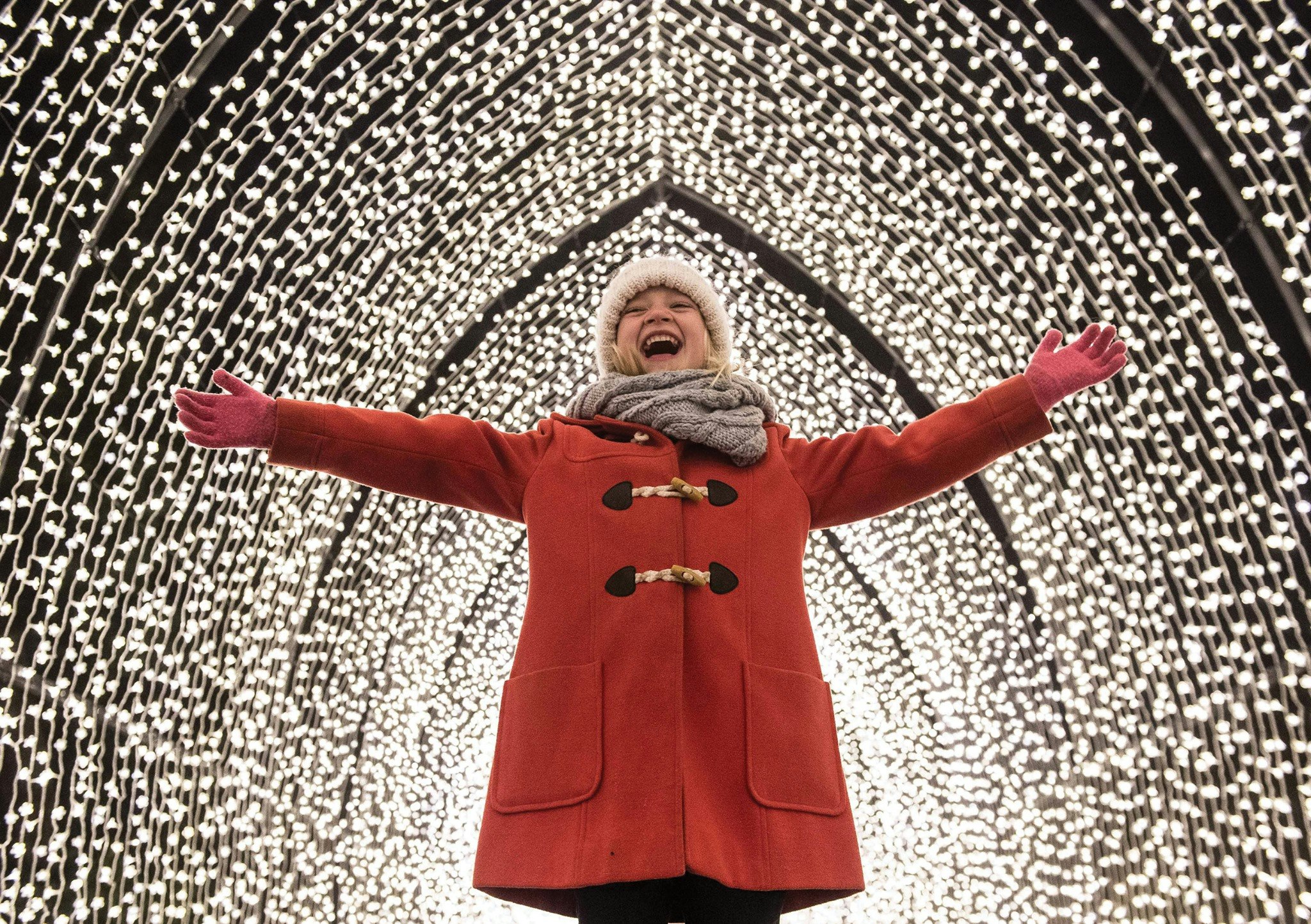Little girl under illuminated lights Bedgebury National Pinetu