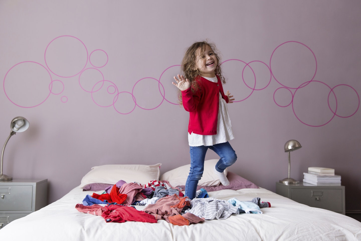 girl dancing on a bed