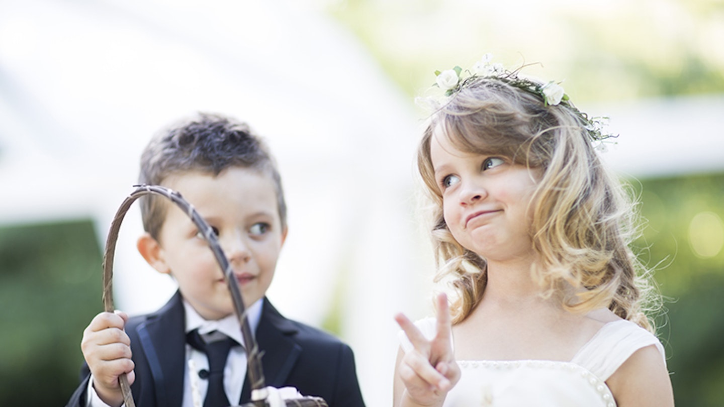 Flower girl with basket and page boy at wedding