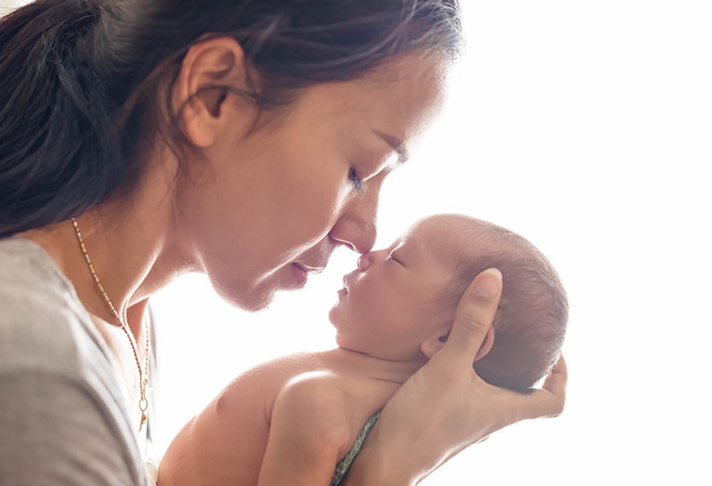 mum and newborn baby face to face