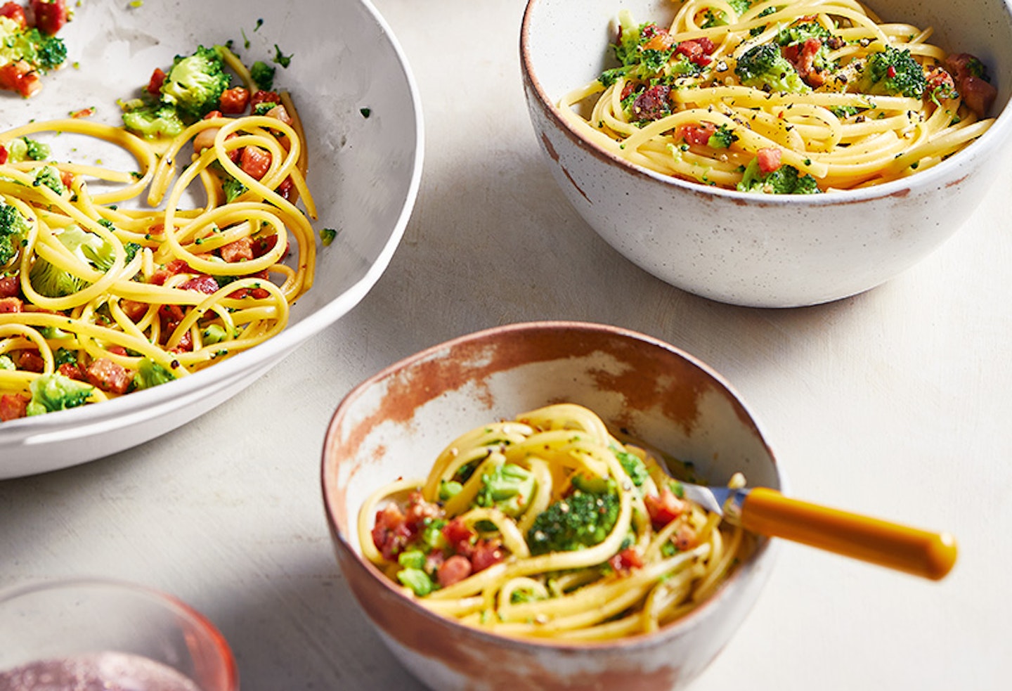 Three bowls of broccoli carbonara