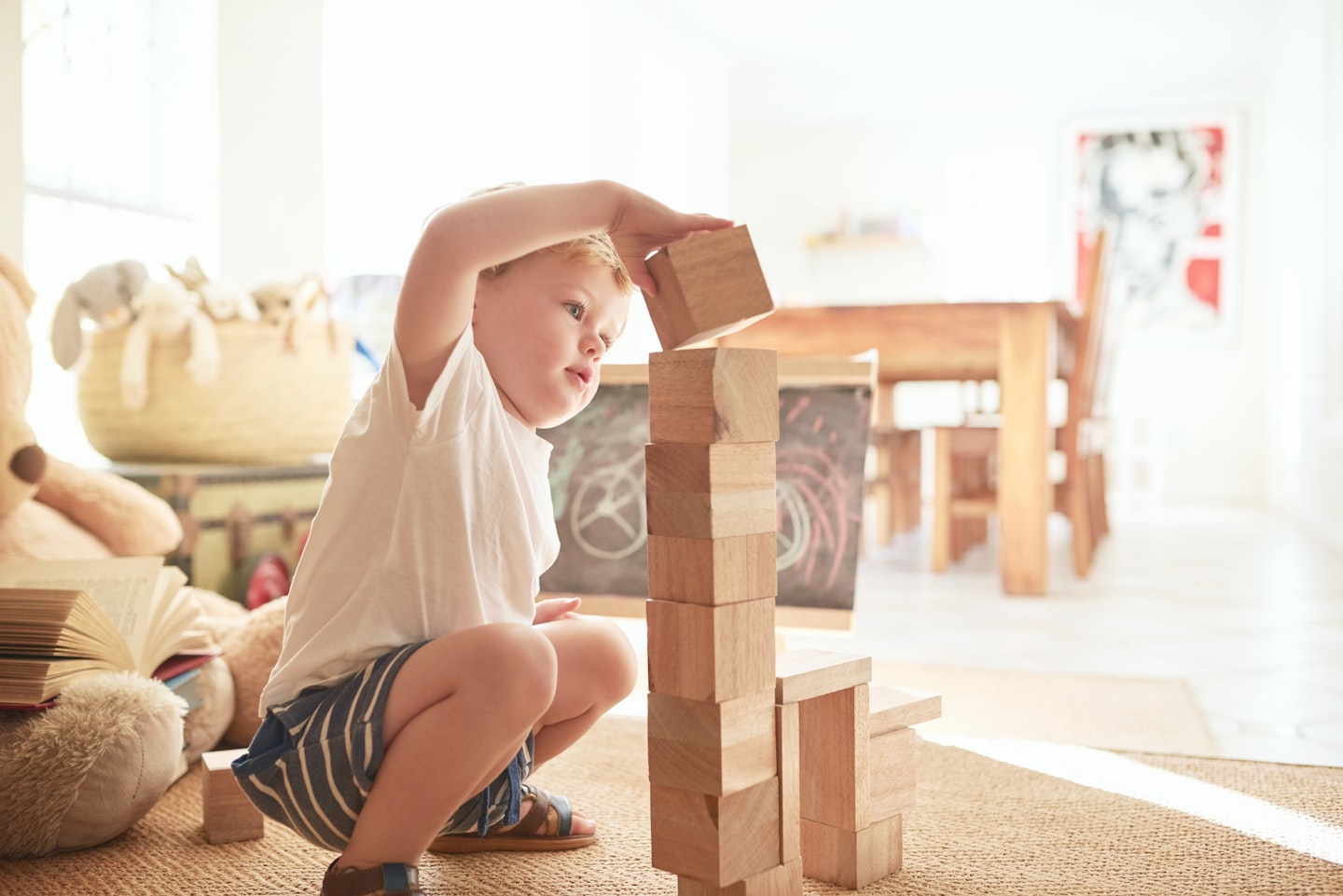 toddler playing with building blocks