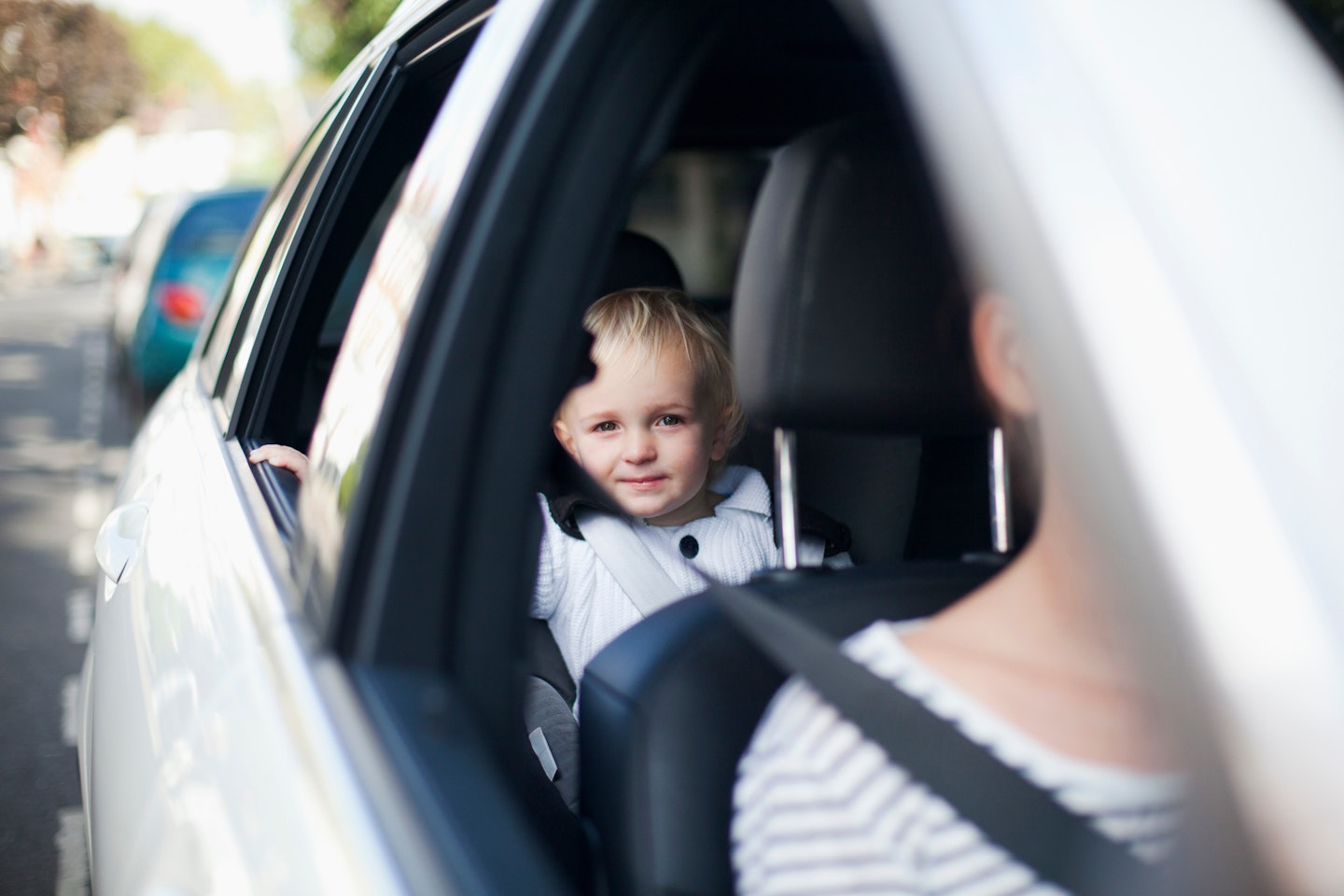 toddler in back seat of a car