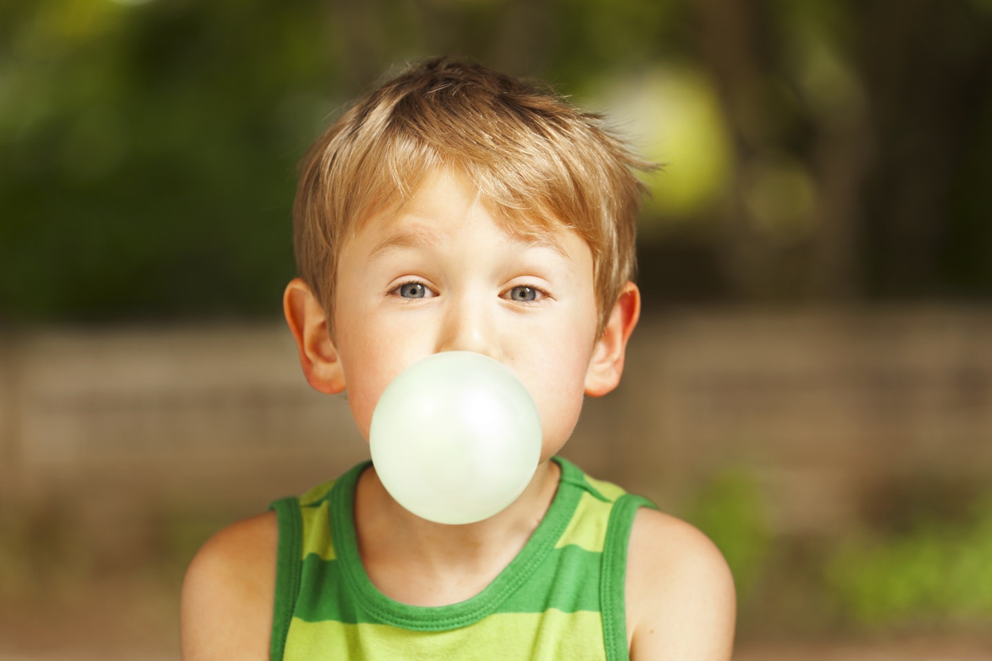 Child blowing bubblegum