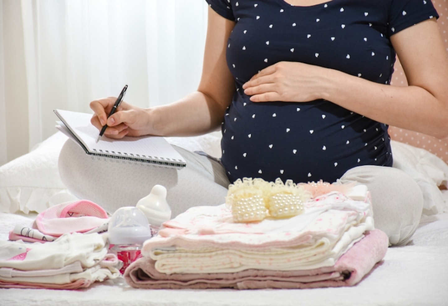 Pregnant woman making a list