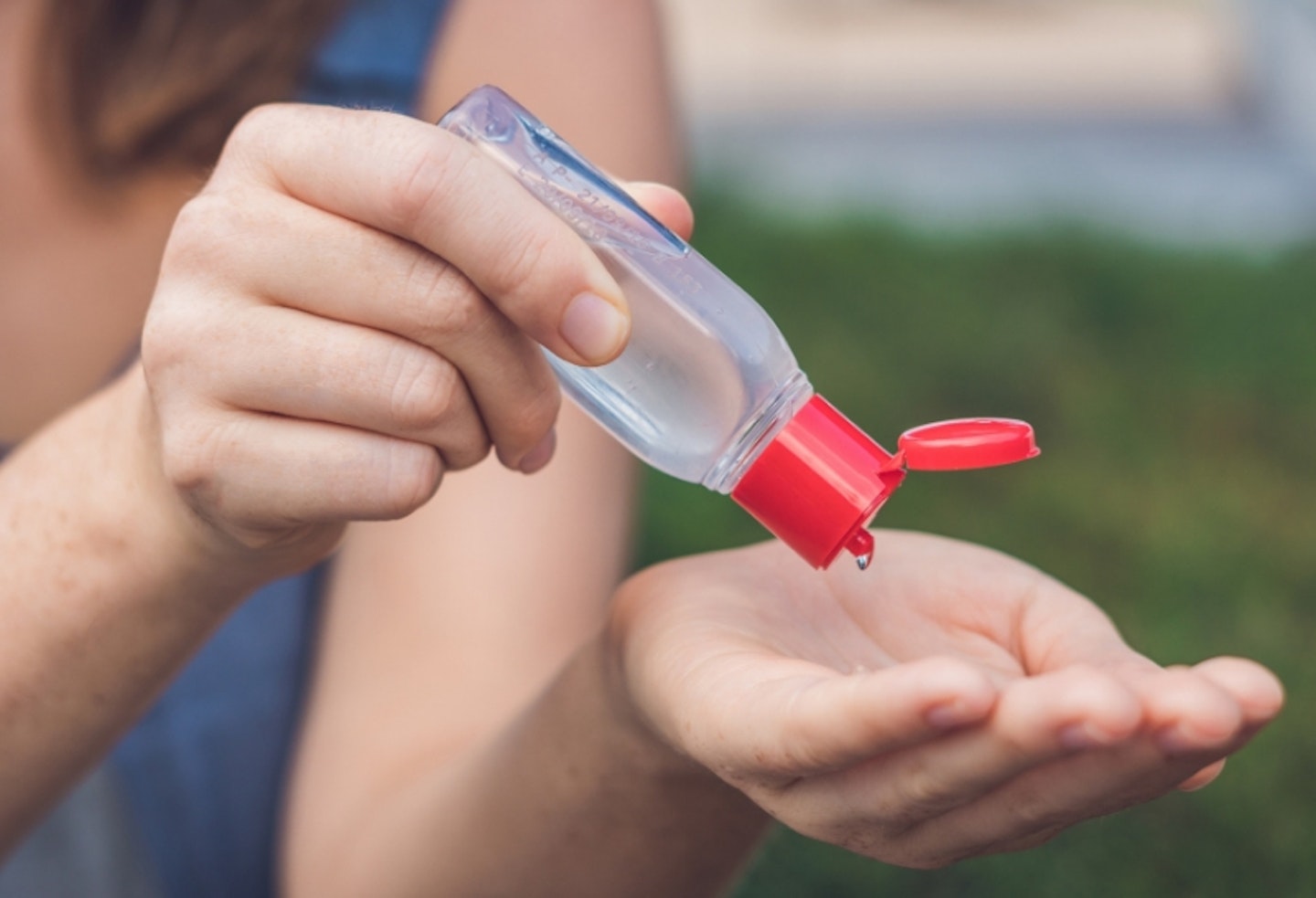 Close up of person using hand sanitiser