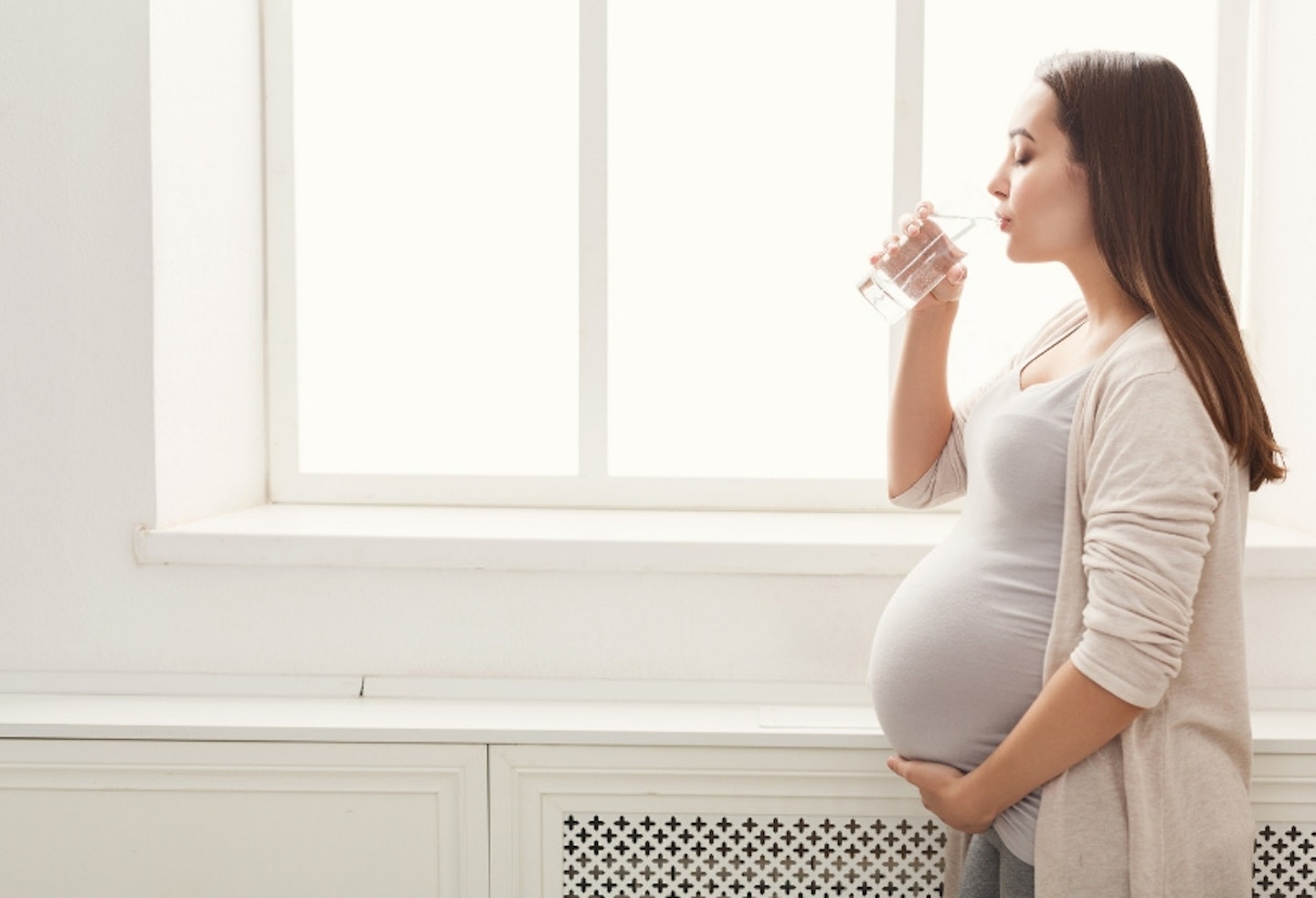 Pregnant woman drinking water