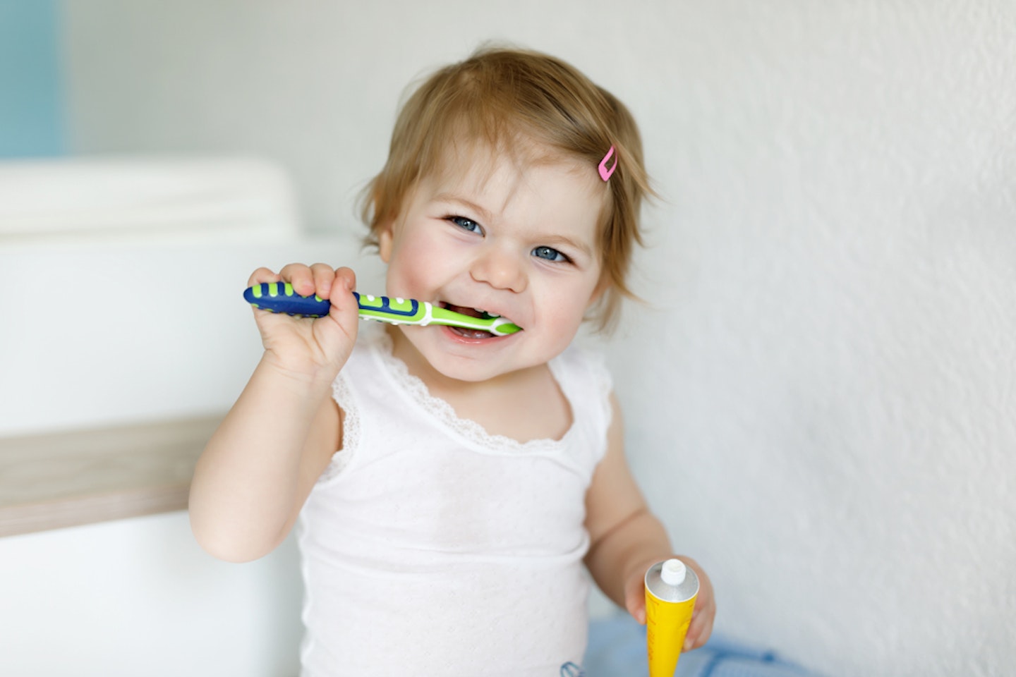 Toddler brushing her teeth