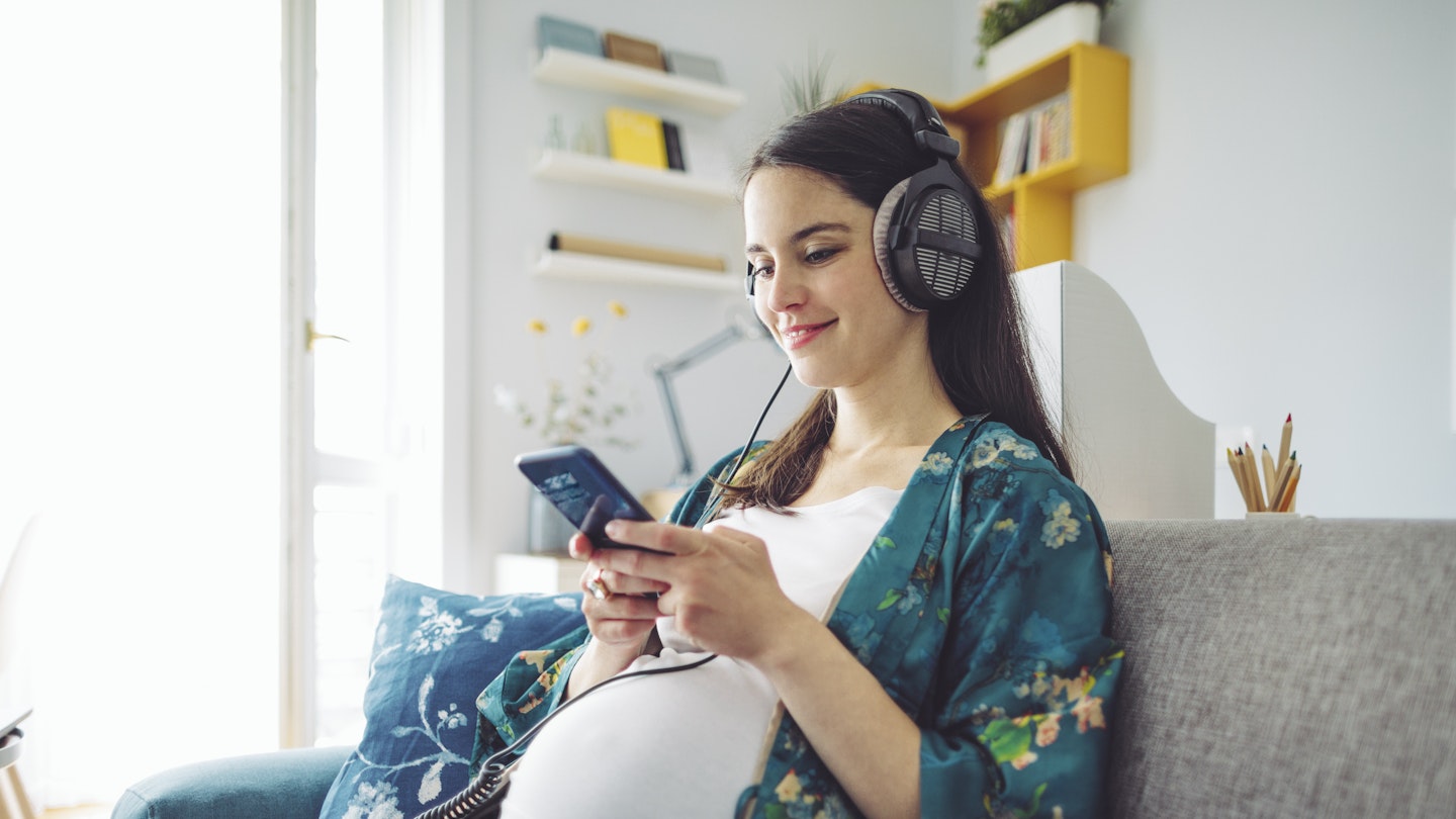 pregnant mum listening to hypnobirthing podcast 