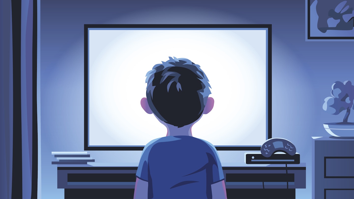 Child sitting in front of tv screen