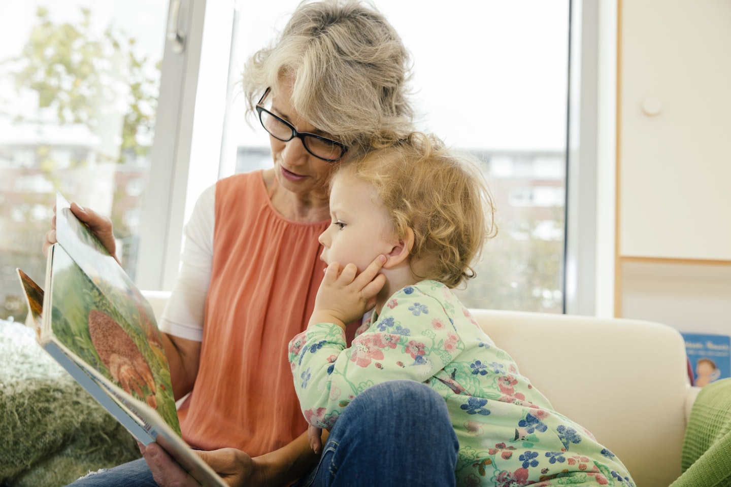 Childminder reading to a toddler