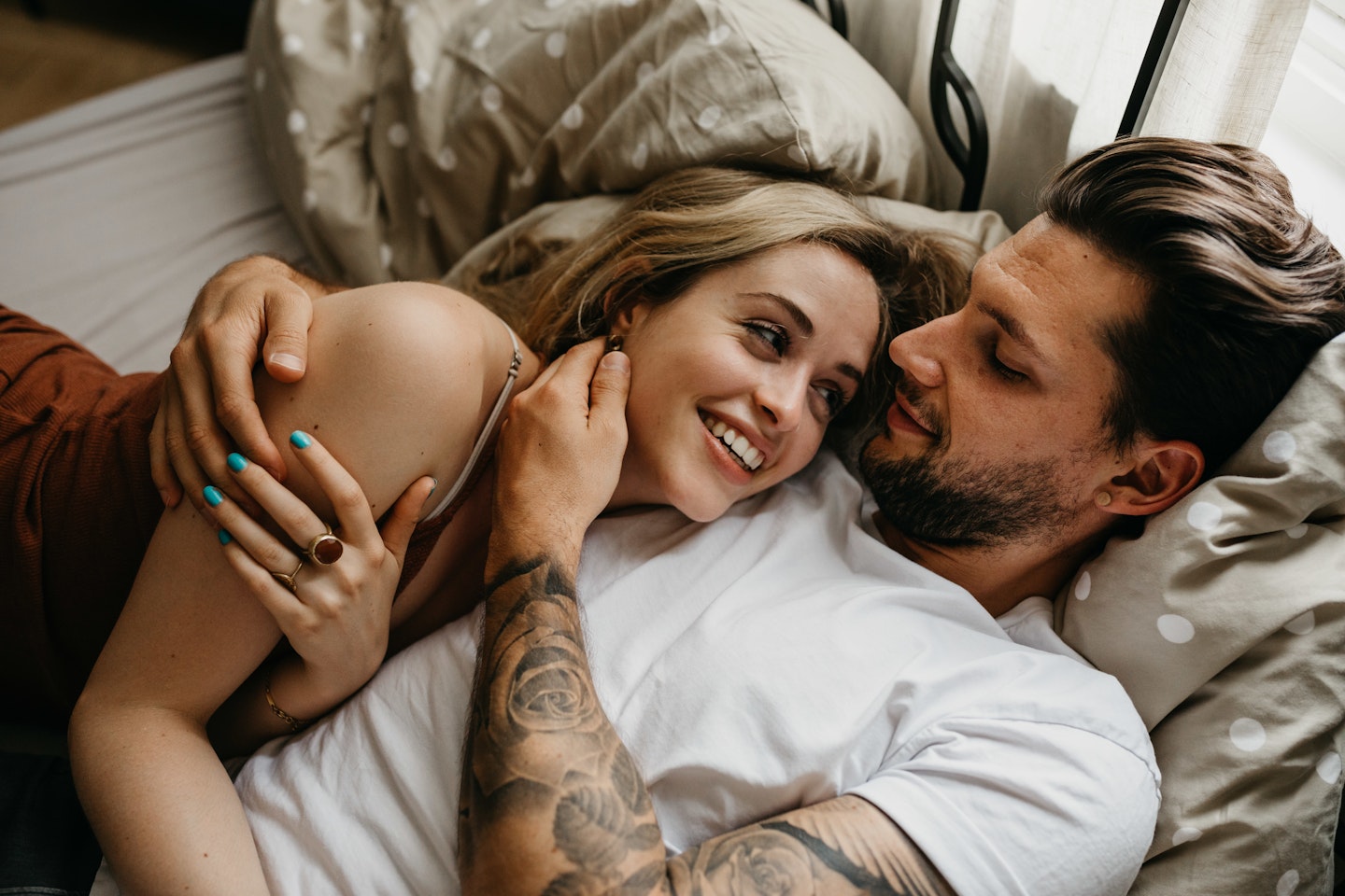 Couple laying in bed