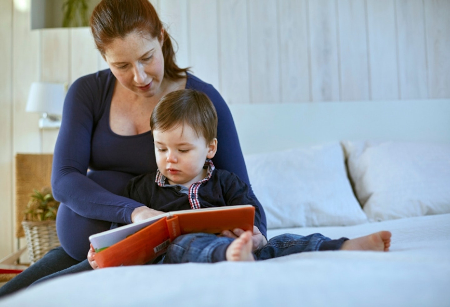 Woman reading to toddler